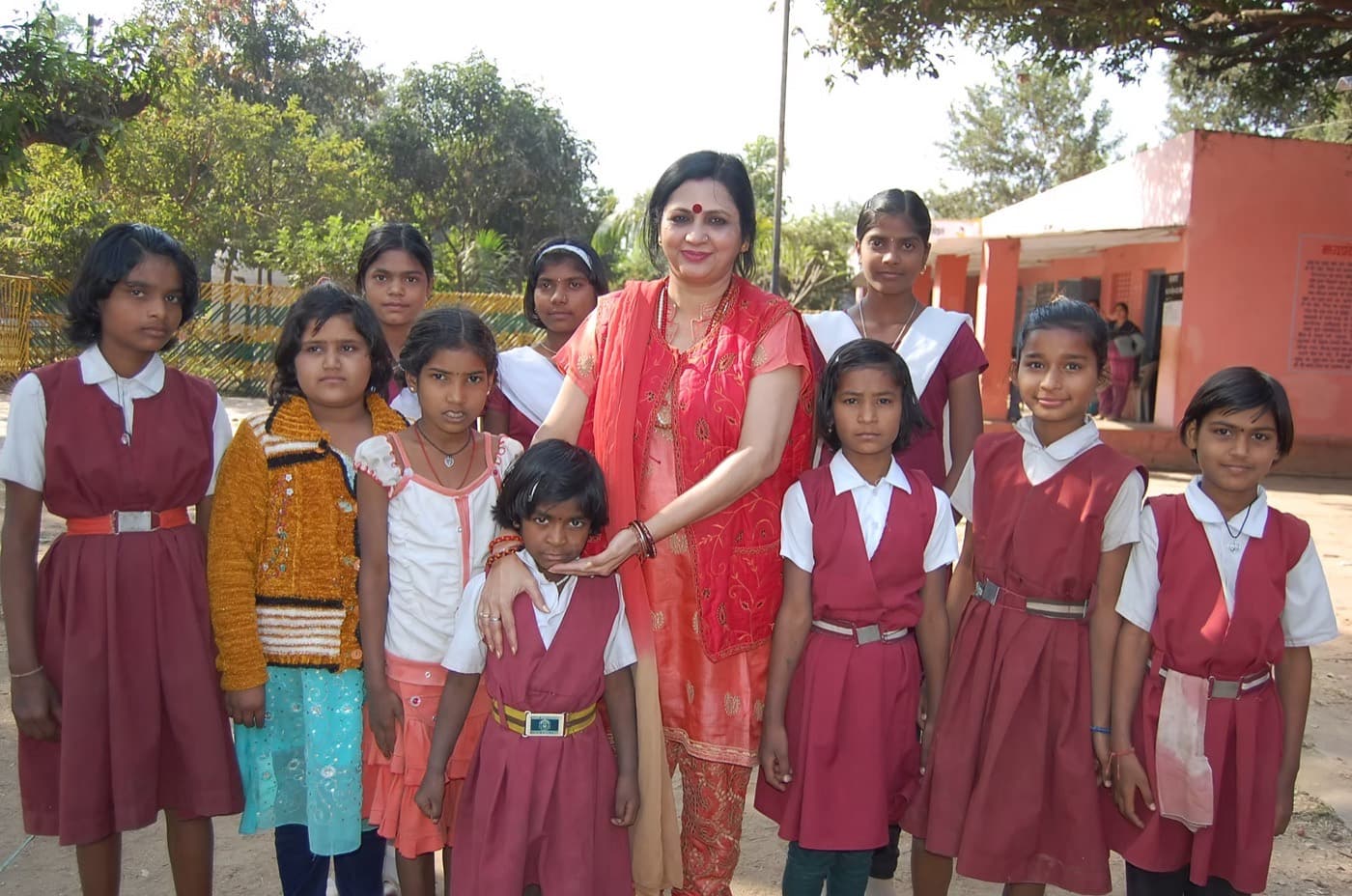 Shri Maa with schoolgirls at a Kanya Saksham Gram program.